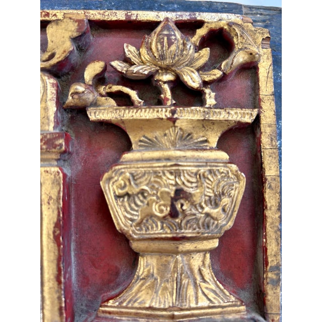 Beautiful gilt alter carved into this Chinese fragment likely from a screen or bed frame. Central alter table draped with...