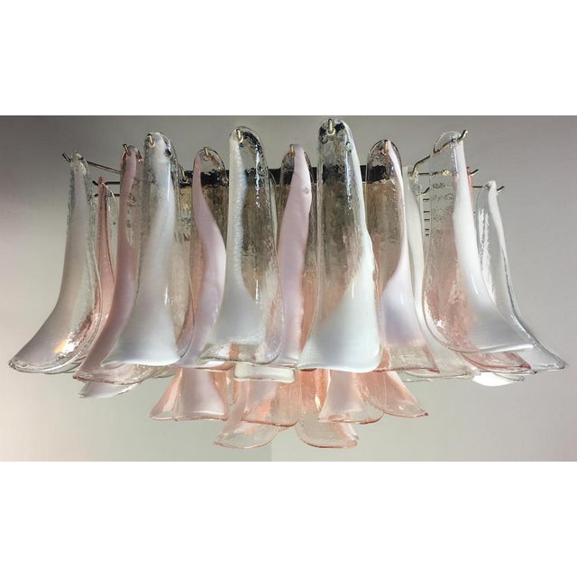 Spectacular ceiling lamp with 64 Murano glasses. The glasses have two different colors, half are transparent with white...