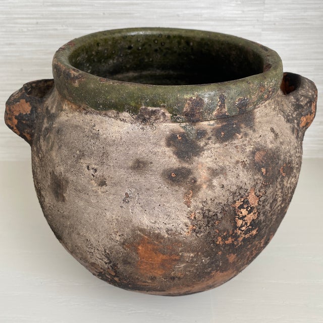 Antique large rustic terra-cotta Turkish yoghurt vessel pot with green glaze on the rim and interior. Features two small...