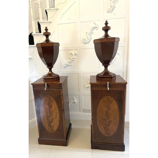 Rare pair of antique George III outstanding quality mahogany inlaid wine urns on original pedestal cupboards having a lift...