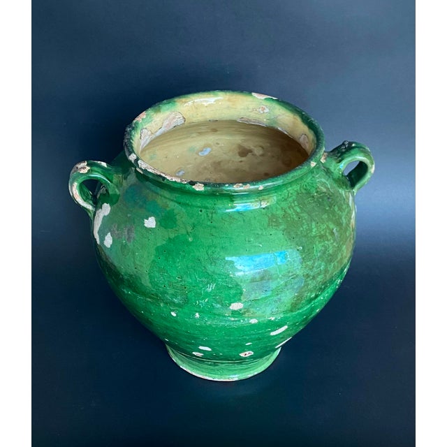 Antique terracotta jar from South-West France, dating to the 19th century. Featuring a rich green glaze with natural...