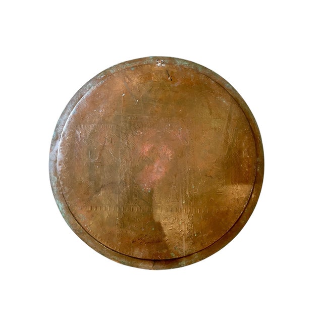 We love this impressive early 20th century Egyptian Revival solid round copper tray with its ample rim. It is decorated...