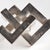 A geometric marvel, this linear sculpture is a strong, substantial accent in a silver finish. Place atop a stack of books...