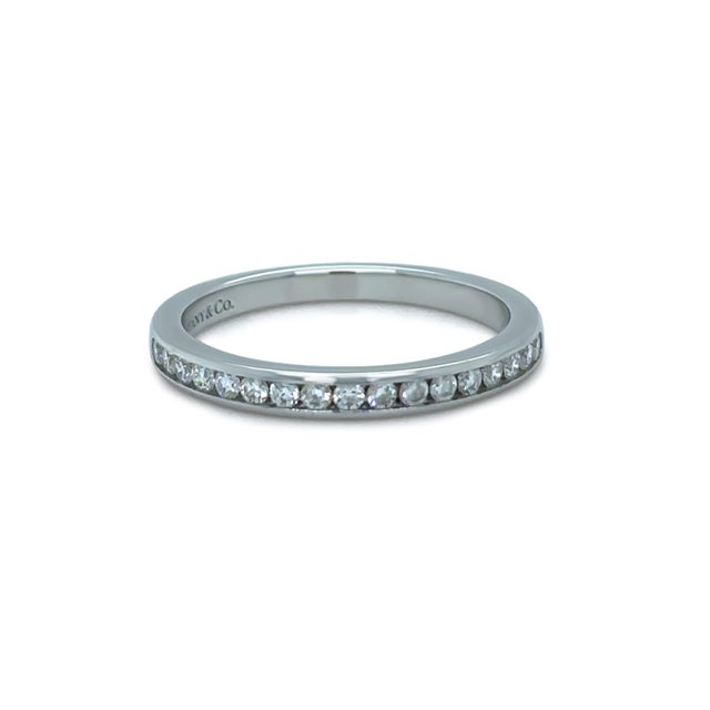 A timeless Tiffany & Co. diamond ring crafted in platinum, featuring a refined arrangement of round brilliant cut...