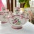 This is a stunning pair of tulipiere vases in a gorgeous hand-painted (French?) faience style. Adorned with a pretty...