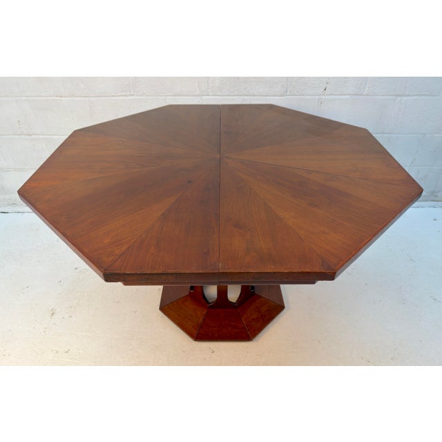 Striking mid-century modern dining table by Walter of Wabash, featuring a distinctive octagonal top and a sculptural...