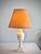 A vintage carved alabaster table lamp featuring a turned baluster form, spiral-fluted collar, and stepped square plinth...