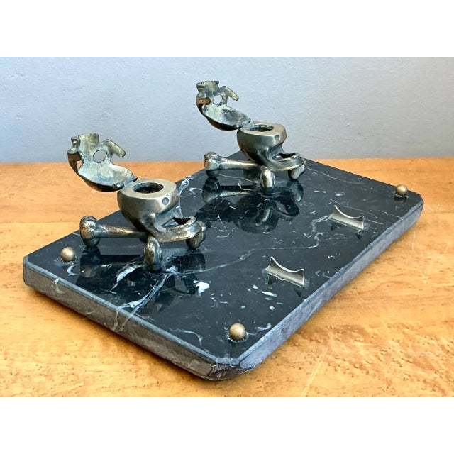Showcasing dramatic Victorian Memento Mori symbolism, this rare early 20th-century desk stand features two cast-brass...