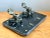 Showcasing dramatic Victorian Memento Mori symbolism, this rare early 20th-century desk stand features two cast-brass...