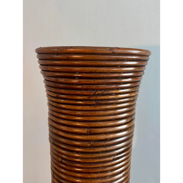 Beautiful large vase constructed completely from spiraled rattan vine. Expertly hand crafted and held together with tiny...