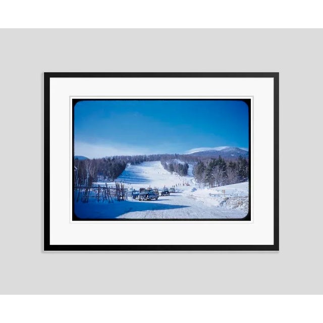 An Icy Drive 1955 Cars parked at the foot of a ski slope at the Stowe Mountain resort, Vermont, USA, 1955. (Toni Frissell)...