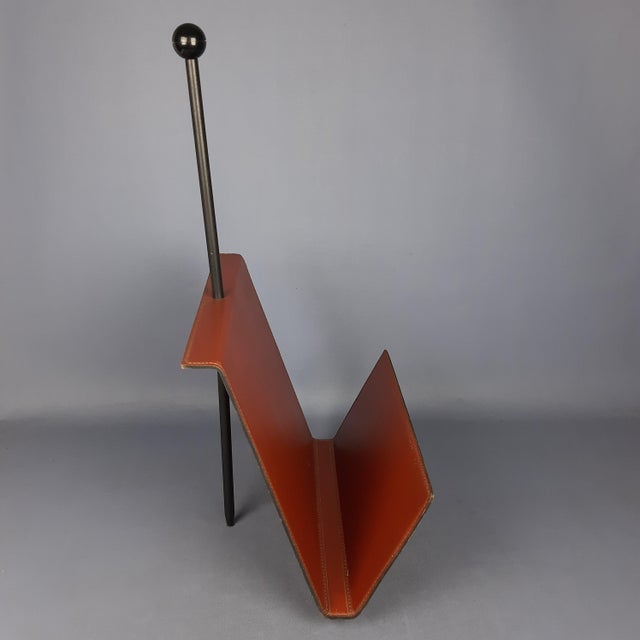 An icon of timeless elegance and design, this magnificent vintage magazine rack perfectly embodies the high-end...