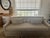 A pair of Restoration Hardware Belgian Slipcovered Slope Arm Bench-Cushion sofas in Sand Performance Linen, in excellent,...