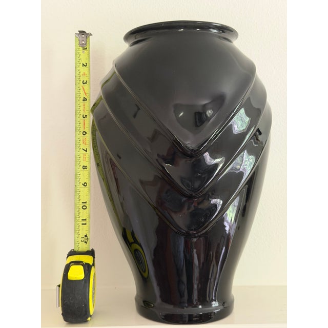 This lovely vintage black glass vase feature a geometric relief with a modern glossy black finish. It would be a bold plan...