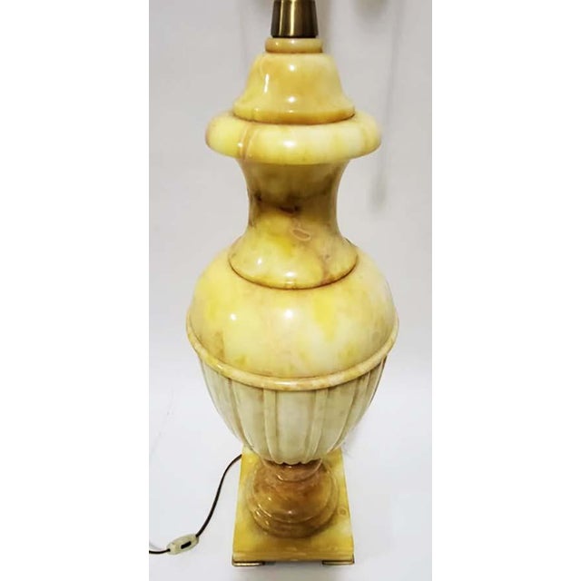 Large scaled Alabaster stone Italian urn lamp, butter yellow & ivory with label Marbro Lamp Co. This elegant lamp boasts a...
