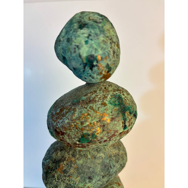 John Costanza Ceramic Stone stacked Sculpture. Made up of 6 stacked ceramic formed rock shapes. Entire piece sits on a...