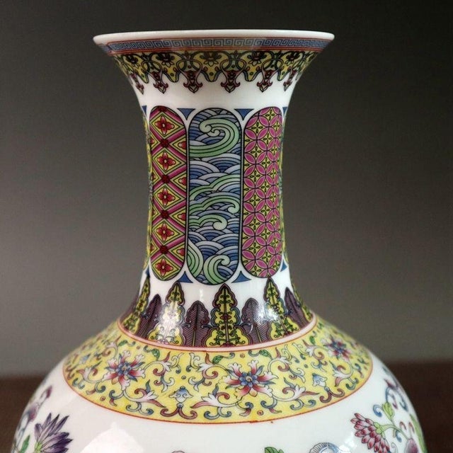Make a vibrant statement in your home with this stunning vintage-style Chinese porcelain vase. This highly decorative...