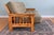 Charming rustic futon sofa featuring a substantial natural wood log frame with distinctive bark-edge detailing and...