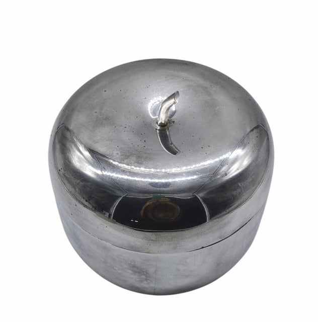 Mid-century “apple” ice bucket attributed to Ettore Sottsass for Rinnovel (1953, Italy). The flattened spherical shape...