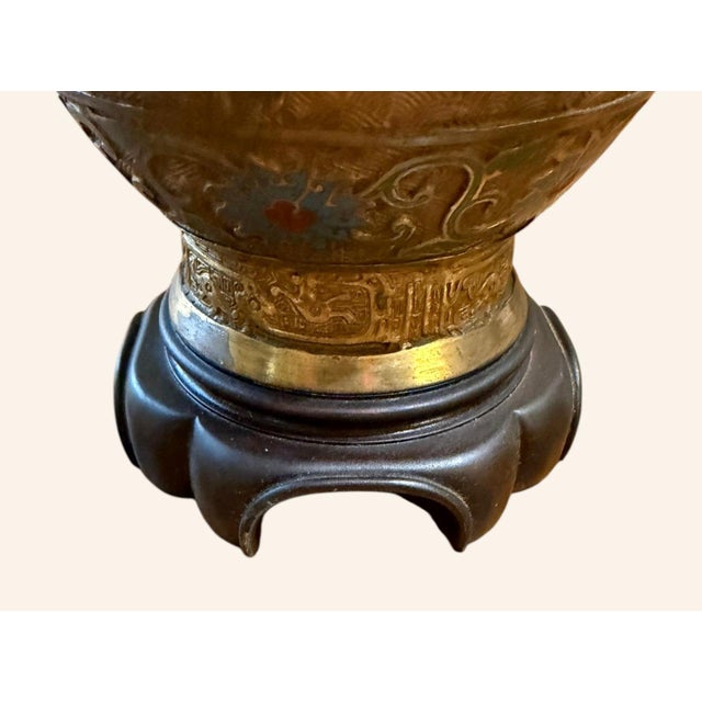Vintage Asian champlevé metal table lamp featuring colorful enamel decoration over an intricately textured brass- or...