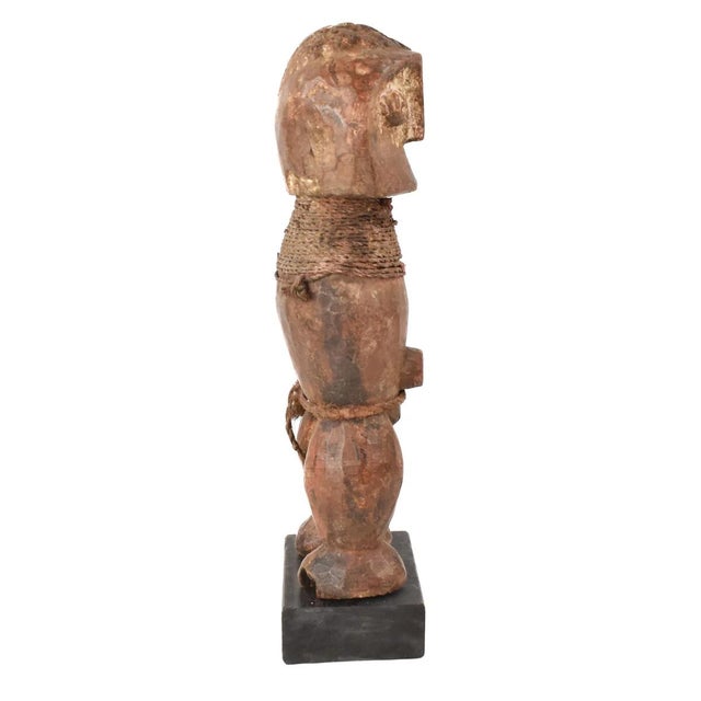 The Songola figure was hand-carved by the Songola people of Congo. The Songola people have a rich artistic tradition of...