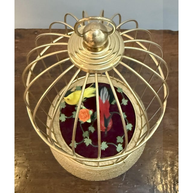 Looking for a little everyday magic? This Belle Epoque charmer has you covered! Inside its gilded brass cage, two jewel-...