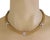 This lovely collar necklace is crafted from 18k yellow gold with white gold accent. It features triple mesh link chain...