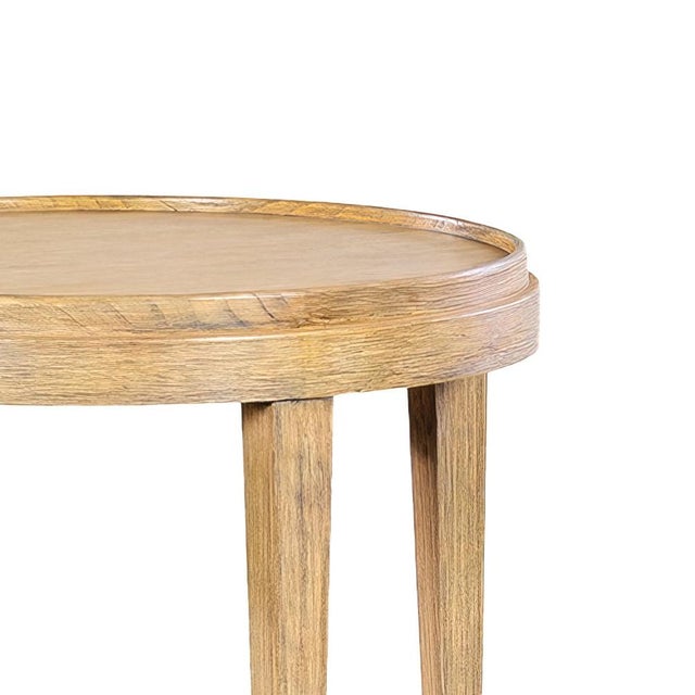 A round end table with our unusual light rabbit finish on Celtids veneer and solids. The two-tier side table with a wooden...