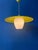 Yellow UFO mid-century pendant lamp featuring a beautiful opaline glass inner shade and a yellow metal outer shade. The...