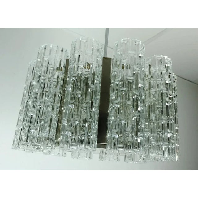 Large hanging lamps from the 1960s from Kaiser Leuchten (label no longer available). 12 tubes made of clear glass with a...