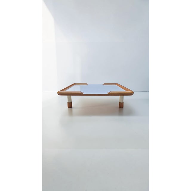 Large coffee table made of oak and cream-colored laminate, a one-of-a-kind piece designed by Marco Comolli. The table...