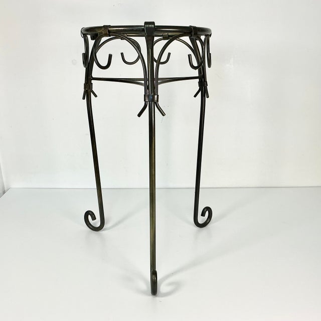 A Brutalist style metal plant stand. Perfect for indoors or outside. Add your own flowering botanical or lush green plant....