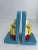 Fantastical whimsical set of bookends on offer, depicting two "duckies" sitting atop a red inflatable tube. Both have a...