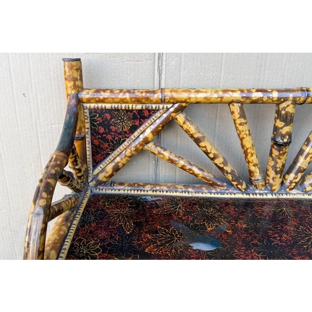 This is a wonderful example of English burnt bamboo! It is a 19th century piece with interior and exterior shelving. The...