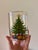 Set of four vintage Christmas tree cocktail glasses from the 1970s featuring beautifully detailed decorated trees with...