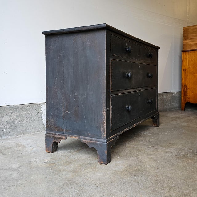 Dimensions: 54.25"W x 21"D x 36.25"H A beautifully timeworn English pine chest, finished in a rich ebonized and waxed...