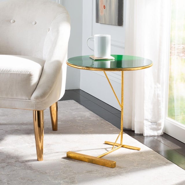 Revitalize any living space with this bold Sionne Round C Table. Sionne's industrial-style legs are given a dramatically...