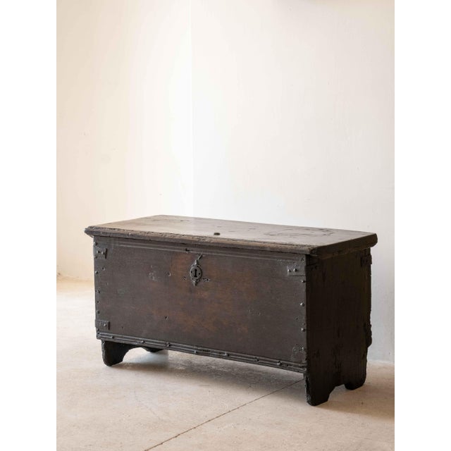 Solid walnut trunk, reclaimed in France and dating back to the 18th century. Wonderful patina and original hardware.