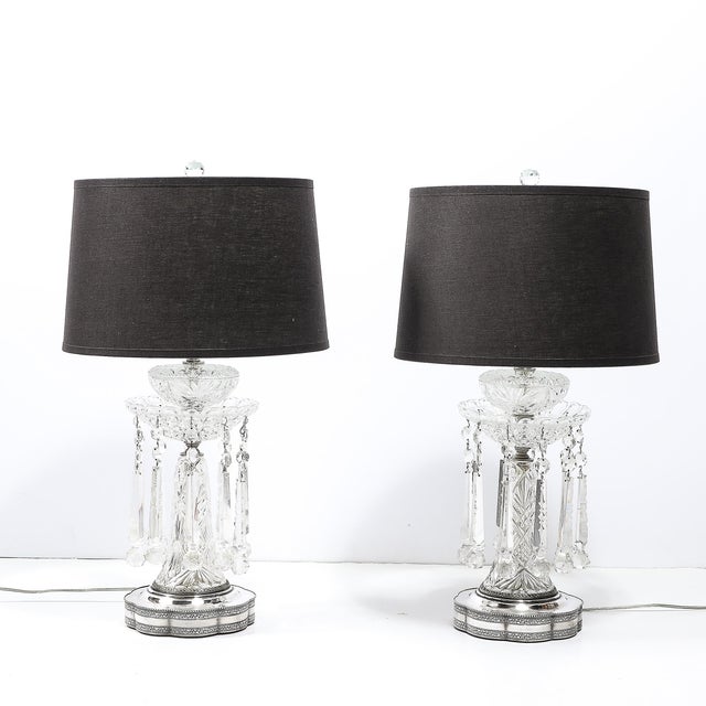 This pair of Art Deco cut crystal and silver-plated table lamps, crafted in the Czech U.S. Zone circa 1946, exemplifies...