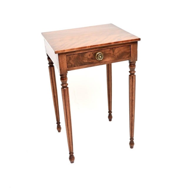 A wonderful antique Georgian period walnut side table. This was made in England, it dates from around 1800-1820 period. It...