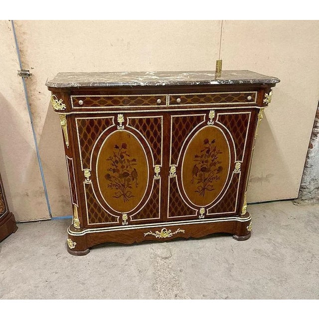 Magnificent French marquetry commode with marble inlays Louis XVI style. Stunning French commode. Has a beautiful gold...