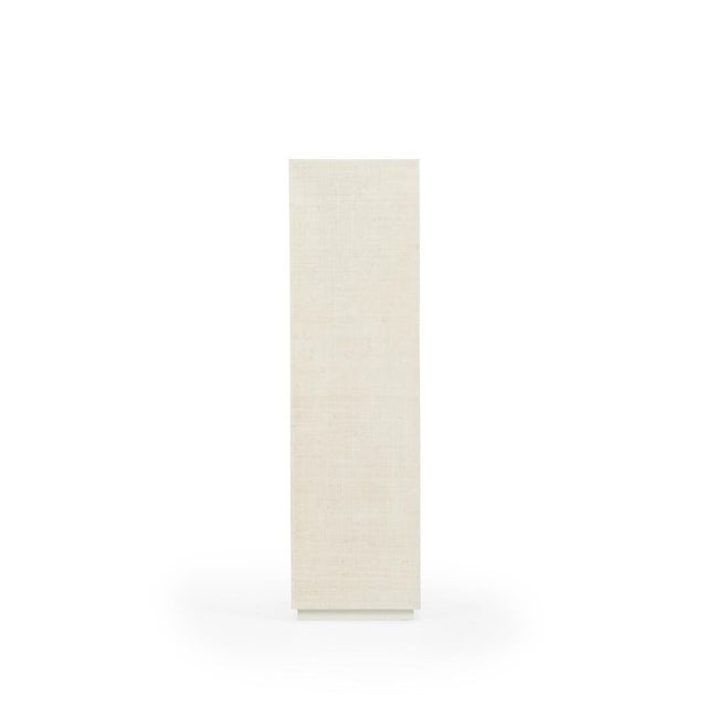 Raffia covered pedestal in white, designed by Jamie Merida.