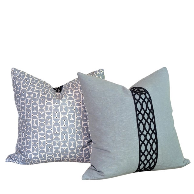 Schumacher mix and match pillows. Mezza Luna on the one side in light blue and navy, with Solid blue textured linen on the...