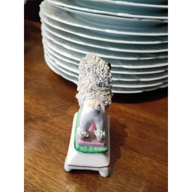This is a charming antique English Staffordshire “spaghetti” (confetti) poodle figure dating to the turn of the 20th...