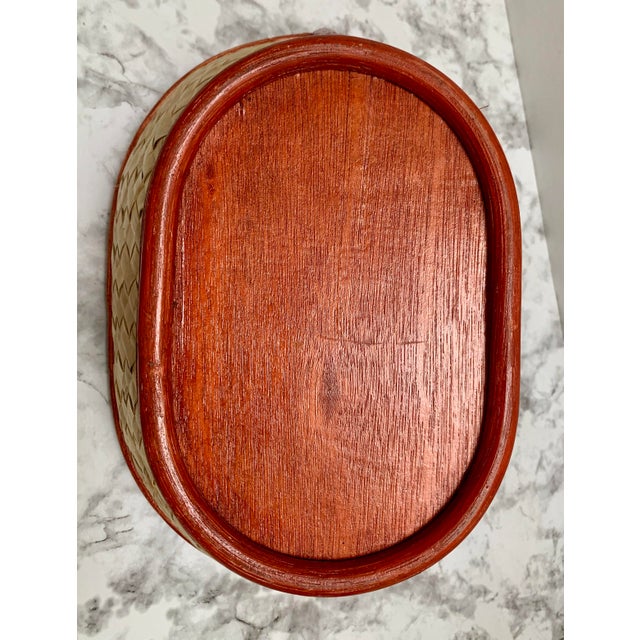 Vintage Asian farmhouse style rustic wood decor and storage basket with woven sides and wood handles.