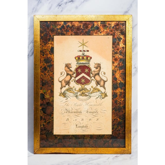 A striking pair of 19th-century hand-colored heraldic engravings, these handsome works bring wonderful Old World character...