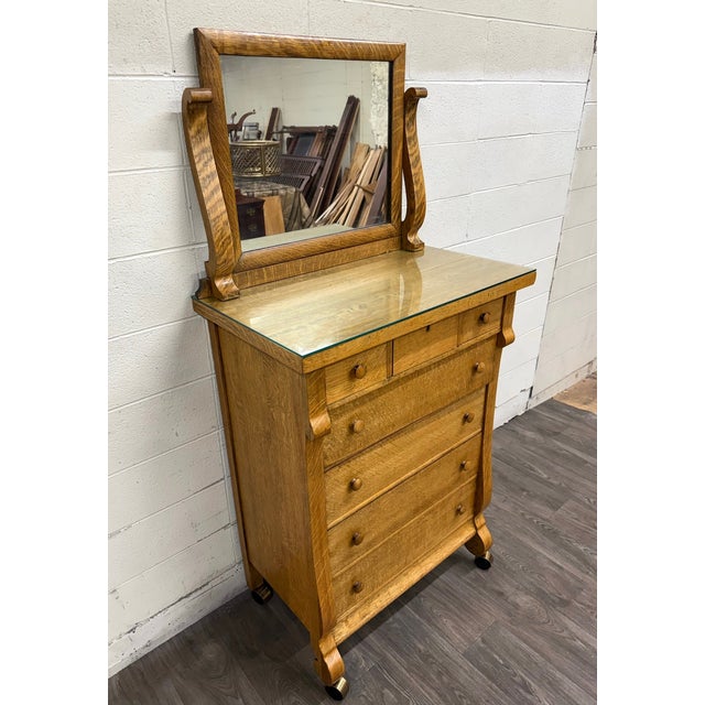 This is a beautiful antique American Empire Revival highboy dresser or chest of drawers crafted from solid quarter sawn...