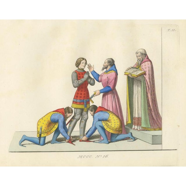 This finely detailed hand-colored lithograph depicts the ceremonial creation of a knight in the 14th century, a key ritual...