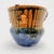 Signed. A ceramic planter with a distinctive and unique color palette. A striking decorative piece for a Scandinavian...
