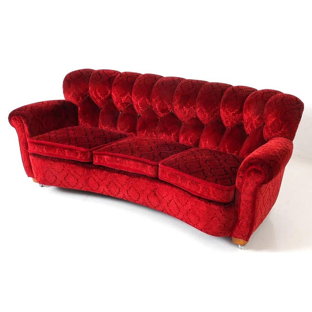 Stunning Danish Art Deco - Mid Century Modern transition tufted back sofa. The sofa is upholstered in a ruby red damask...